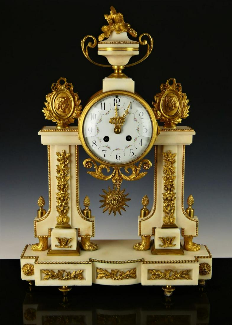19th C FRENCH AD MOUGIN ORMOLU ALABASTER CLOCK: Antique French Ad. Mougin mantel clock crafted of alabaster and ormolu gilt bronze. Has wihite enamel dial with floral garlands and black Arabic numerals. Gilt scrolled hour and minute hands. Dial fla
