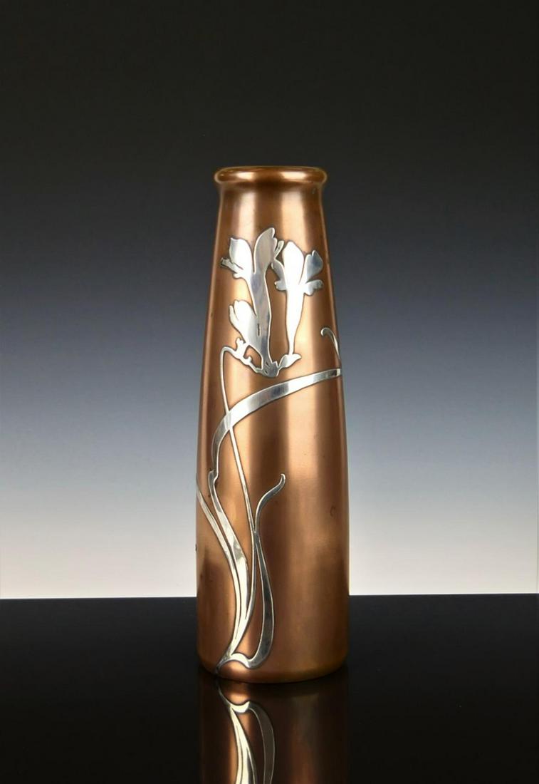 HEINTZ VINTAGE LARGE STERLING OVER COPPER VASE: Heintz art Metal company. In excellent condition . Measures 11" tall with nice Lilly shape silver flowers. Thick rim. Marked to bottom #3682 Third part shipping required