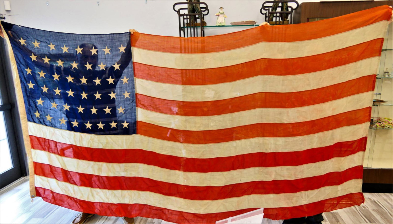 LARGE 46 STAR AMERICAN FLAG: In 1906 we welcomed Oklahoma into the Union. That grew our Flag to 46 stars. This one flew over a school in the Mid west. Measures 5' X 9' . A few small losses overall fair condition. Third party ship