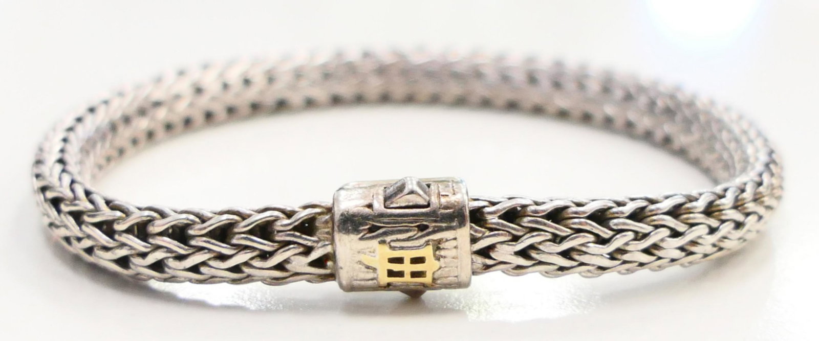 JOHN HARDY PINK SAPPHIRE AND STERLING BRACELET: Measures about 7" long. From a local estate. Fabulous condition with 18 small round pink sapphires. Third party shipping required