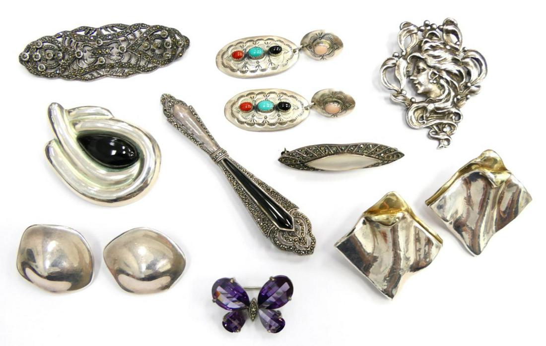 LARGE VINTAGE STERLING JEWELRY LOT: To include ; amethyst butterfly pin, Pair of Navajo earrings, MOP and marcasite pin, 2 pair of Mexican earrings, onyx and sterling Mexican brooch. Nouveau Mucha lady pon, Long Marcasite pin , MOP and 