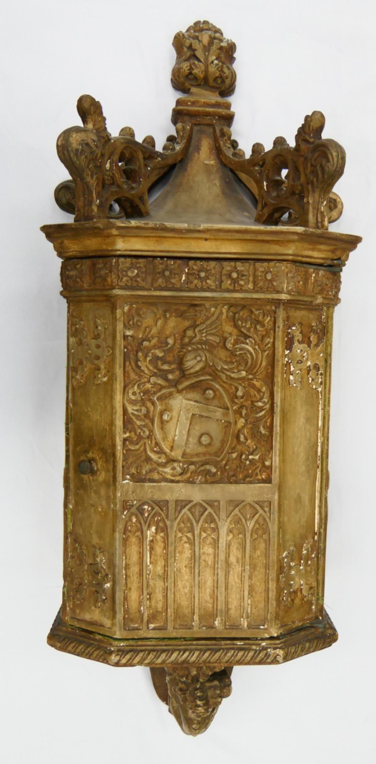 ANTIQUE CONTINENTAL WOODEN LION'S WALL CABINET: Antique Continental heavy wooden wall cabinet having a figural lions design and completed with hinged door. Measures approx. 32" length x 11" width x 8 1/2" depth (81.3cm x 27.9cm x 21.6cm).