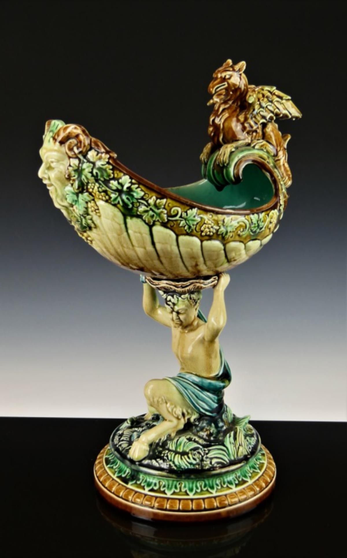 ANTIQUE RORSTRAND MAJOLICA FIGURAL CENTERPIECE: Centaur holding up a boat with mythological griffin. Measures 17" tall. and about 11" wide. Dates probably to late 19th century. Top Majolica producing company of Sweeden. Third party shipping require