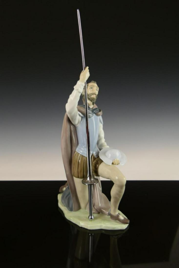 LLADRO GLAZED PORCELAIN "THE QUEST" FIGURE #5224: Lladro glazed Spanish porcelain figure depicting Don Quixote kneeling with sword titled "The Quest" or "Don Quijote Arrodillado" number 5224. Sculpted by Salvador Furió. Issued in 1984 and retiredin