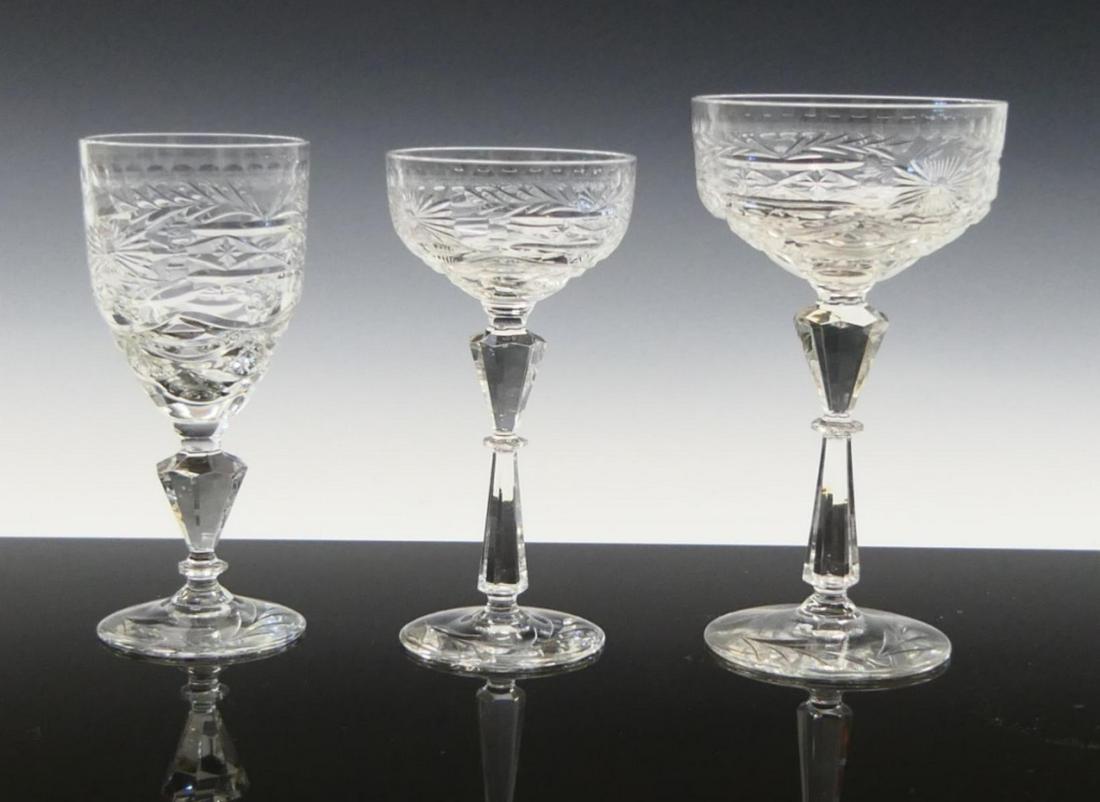 36pc MID CENTURY ELEGANT GLASS CRYSTAL STEMWARE: A 36 piece mid century Elegant glass cut crystal stemware set to include 12 champagne / sherbert glasses (approx. 6 3/4" x 3 3/4") x 16 wine glasses (approx. 6 1/8" x 2 5/8") and 8 liquor / cocktail g