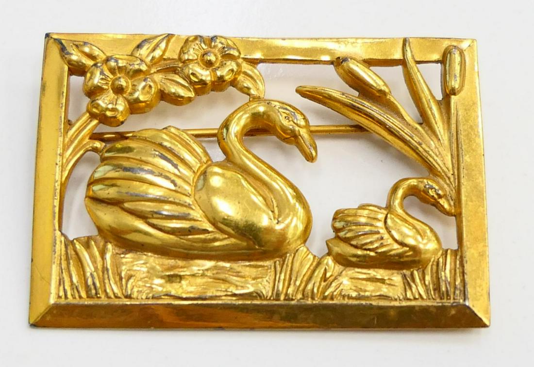 VINTAGE CORO VERMEIL STERLING SILVER SWANS BROOCH: Vintage vermeil sterling silver reticulated brooch pin depicting swan and cygnet in water by Coro. Marked "STERLING CRAFT BY Coro" to applied plaque and further marked "STERLING Coro DES. PAT. PEND."