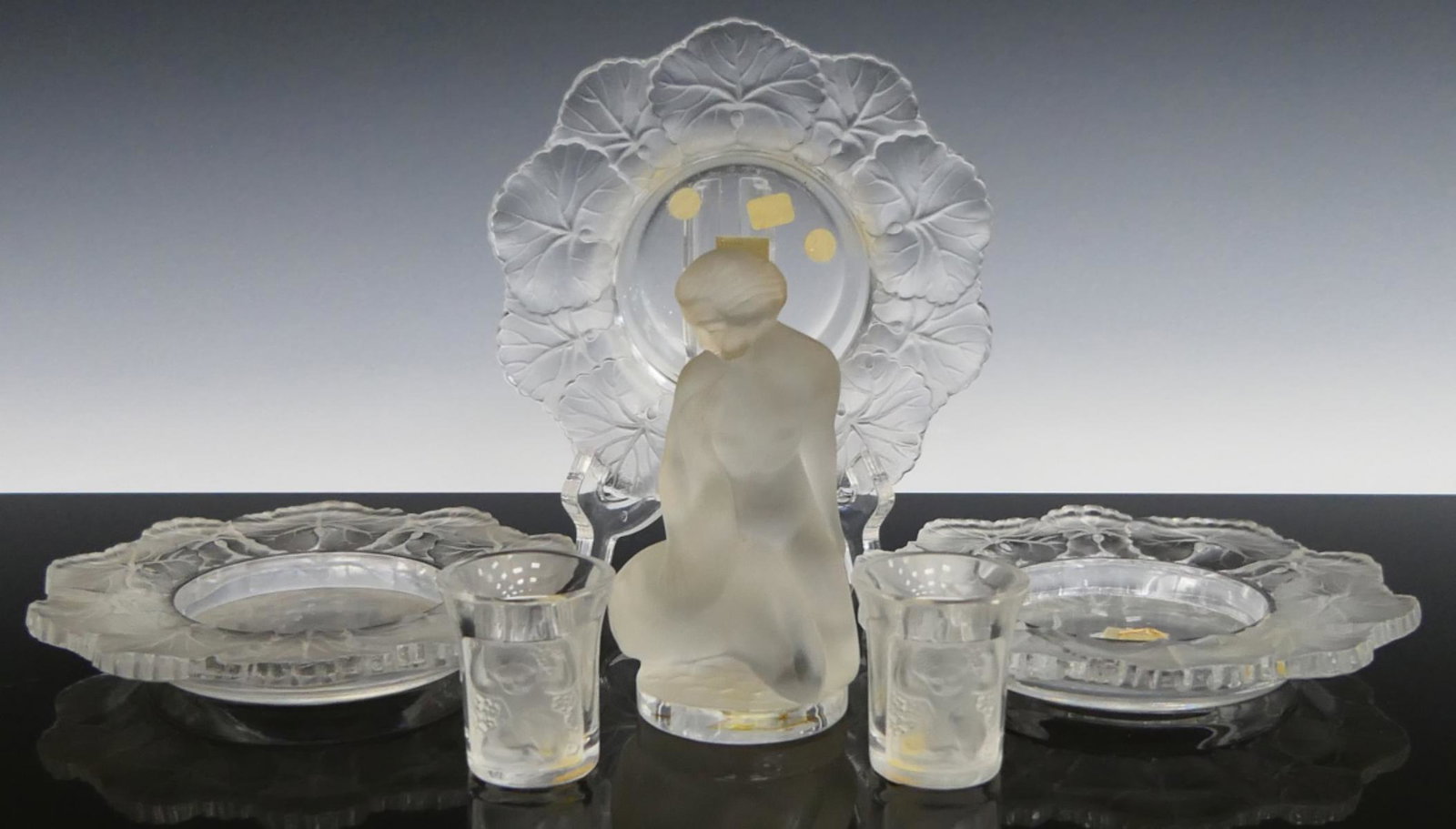 LALIQUE 6 PIECE LOT CRYSTAL INC. ENFANT SHOT GLASS: 2 Enfant 1 3/4" shot glasses, (3) 5 1/2" Honfleur bowl, and Leda with swan 4 34" tall. Third party shipping required.