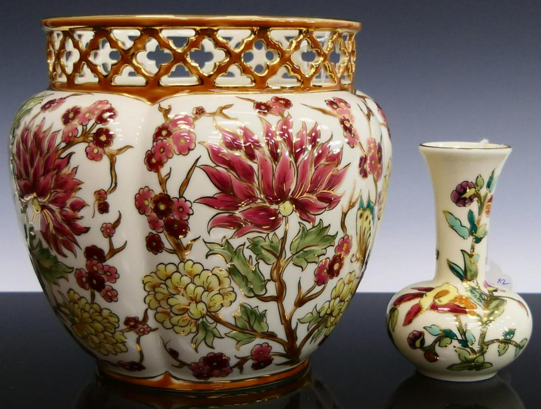 2 PIECES OF ZSOLNAY PORCELAIN 2 VASES HAND PAINTED: To include a large vase floral painted with reticulated rim 7" tall, along with a small 4 1/2" bud vase. Third party shipping is required for this lot