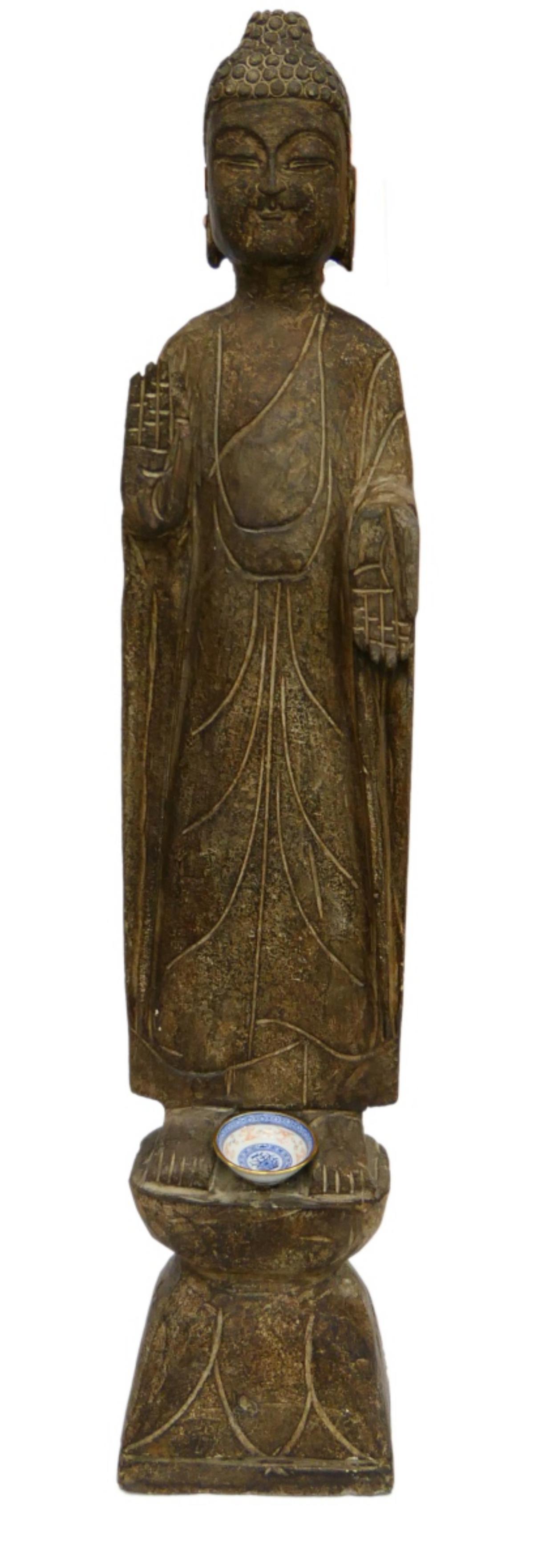 LARGE CHINESE CARVED STONE TEMPLE BUDDHA SCULPTURE: A large and heavy carved brown stone sculpture depicting a standing Buddha. Measures approx. 36 1/2" height (92.7cm).