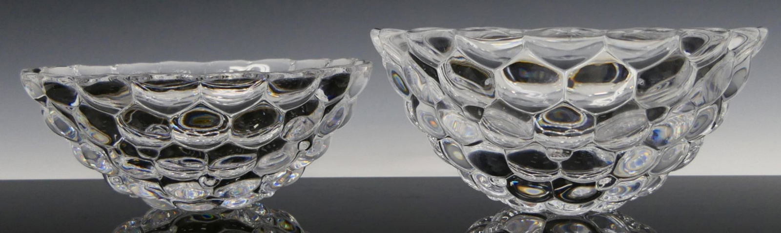 LOT OF 2 ORREFORS ANNE NILSSON RASPBERRY BOWLS: A lot of 2 graduating Orrefor's Swedish glass raspberry bowls having a raspberry designed by Anne Nilsson (SWEDISH, born 1952). Each with script mark to bottoms. Largest measures approx. 3 7/8" height