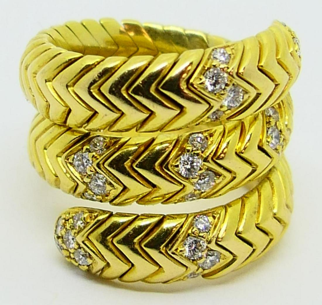 BVLGARI 18KT Y GOLD & DIAMOND SNAKE RING: Triple looped size 5 1/2 with 32 round brilliant diamonds. Property of a Miami Beach lady. Signed Bvlgari 750. Total weight of the ring 21 grams. Third party shipping required