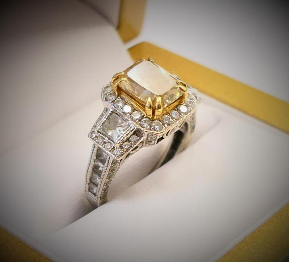 GIA 18K 2-TONE 2.22CT FANCY YELLOW DIAMOND RING: Impressive women's estate ring crafted of 18k white gold featuring a center natural rectangular modified brilliant cut fancy brown-yellow diamond, VVS2 clarity approx. 2.22ct. Center diamond measures 