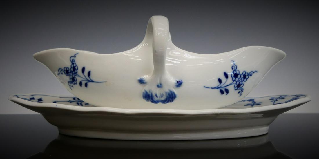MEISSEN BLUE ONION GRAVY BOAT & UNDER TRAY: Measures 8" long. Bears the Meissen blue cross sword mark under glaze to base. third party shipping required