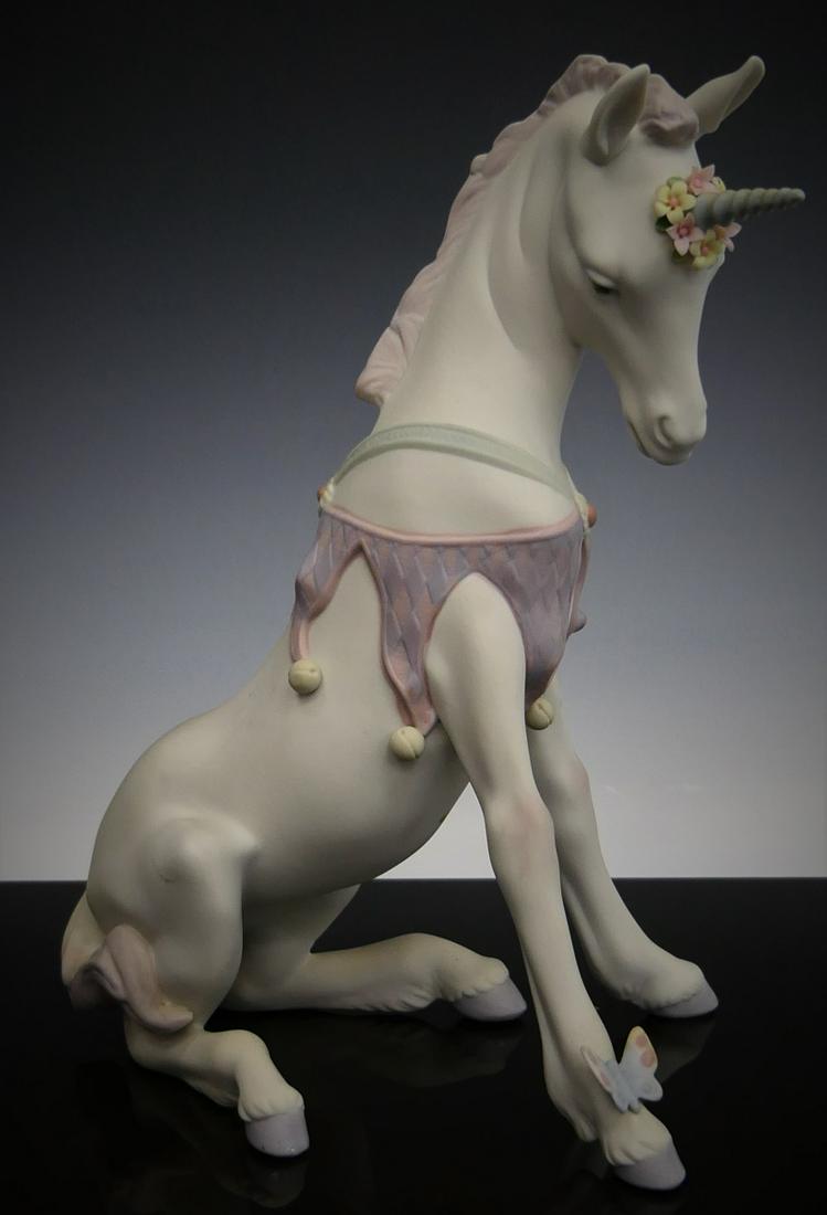LLADRO # 7697 MAGICAL UNICORN NO BOX: Measures about 8" tall. Depicts a unicorn with butterfly on hoof. Third party shipping required