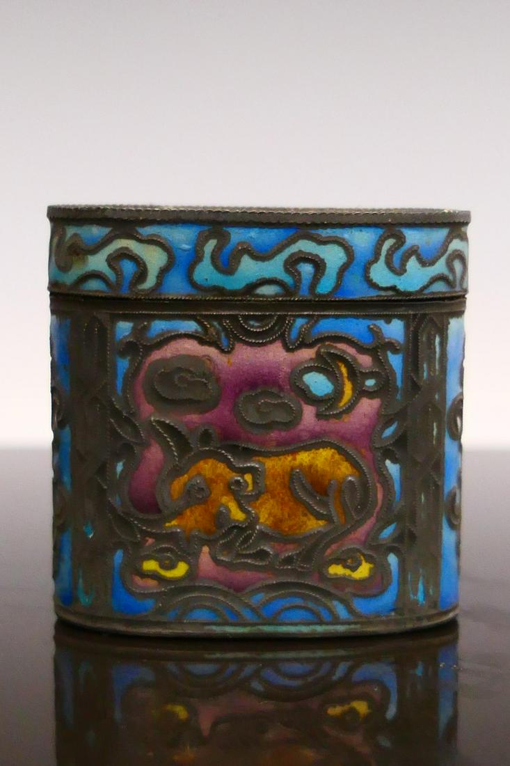 VINTAGE CHINESE ENAMELED SILVER OVAL SNUFF BOX: Vintage Chinese enameled silver oval form covered snuff box depicting figures and mythological beasts. Impressed calligraphy silver marks to bottom. Measures approx. 1 3/4" height x 1 3/4" width x 7/8