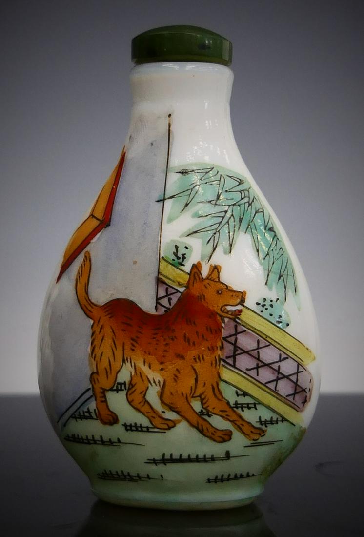 CHINESE MILK GLASS HAND PAINTED DOG SNUFF BOTTLE: Chinese milk glass snuff bottle having a hand painted design with dog. Bottom holds red three character calligraphy mark. Completed with spinach jade stopper. Measures approx. 3" height (7.6cm).
