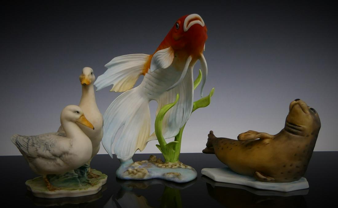 3 KAISER GERMANY HAND PAINTED ANIMAL SCULPTURES: A lot of three Kaiser German hand painted porcelain animal figures to include ducks designed by Wolfgang Gawatka, otter and gold fish. Tallest measures approx. 5 3/4" (14.6cm).