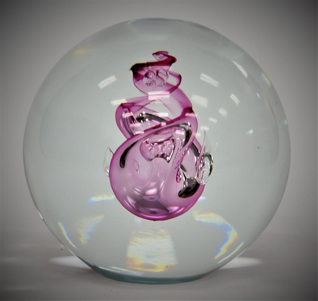 HUT PRINC CZECH ART GLASS ROUND SCULPTURE: Hut Princ Czechoslovakian art glass large round sculpture with pink swirl design. Dremel signed by artist to bottom and retains factory label. Measures approx. 5 1/2" height x 5 1/2" diameter (14cm x 