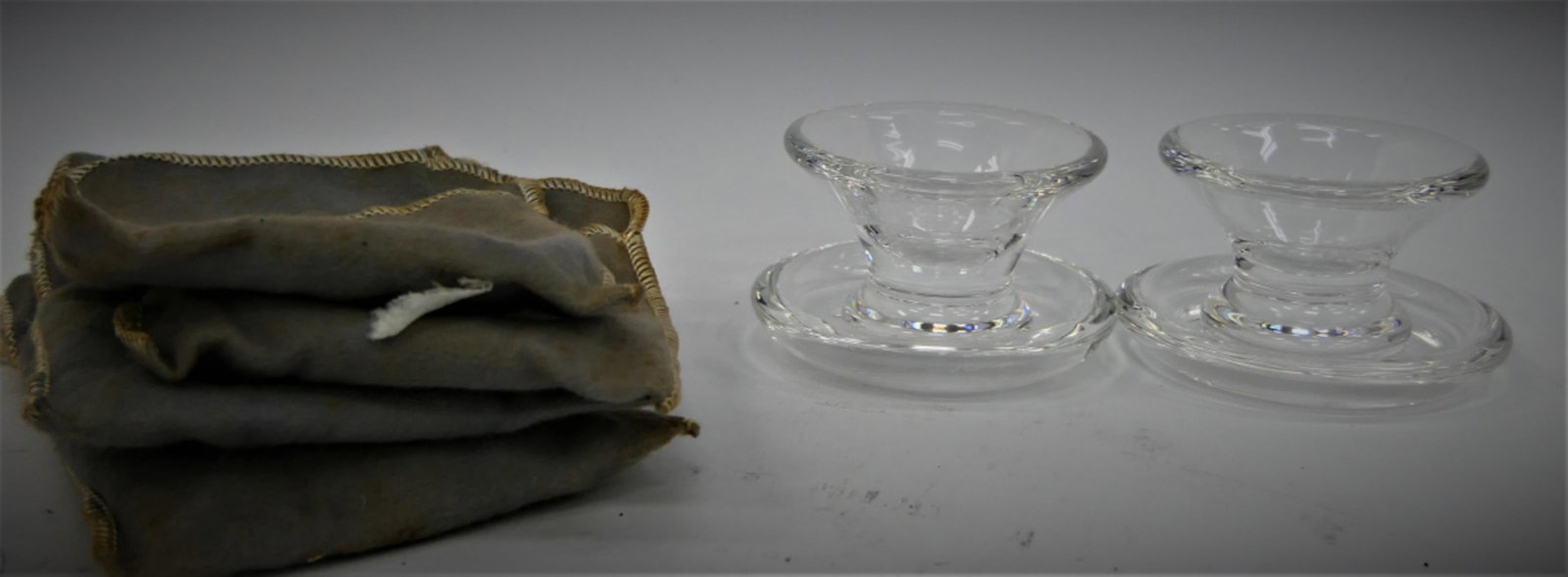 LOT OF 2 SIGNED STEUBEN RARE SALT CELLARS & PLATES: Each stands 1 1/2" tall and 2 1/2" wide at rim. All signed Steuben. All come with dust bag Third party shipping required