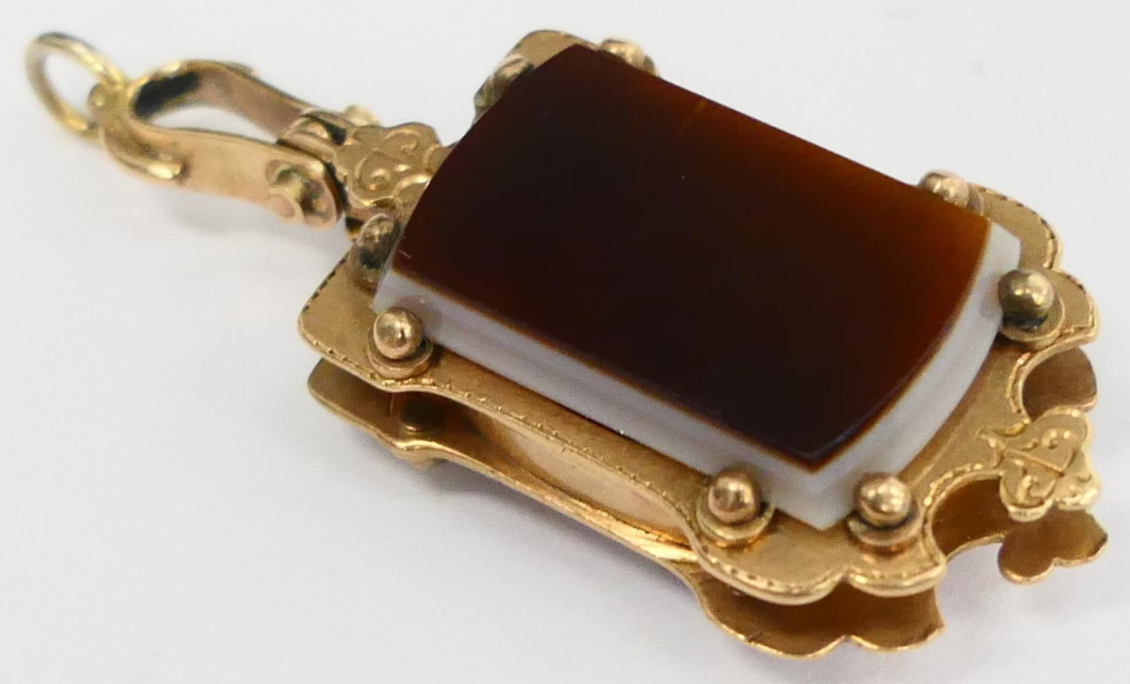 VICTORIAN 9KT Y GOLD & CARNELLIAN PENDANT: Rectangular in design, about 1 1/4" , Carnelian on both sides. Total weight 9.65 grams / 6.2 DWT