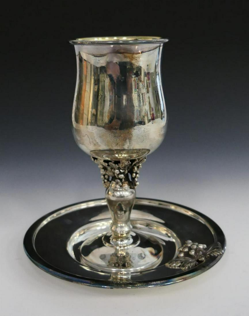 HAZORFIM 925 ORNATE WINE CUP & PLATE (7 OZT): 7" Cup with applied grapes motif. comes with a matching 6 1/2" under plate. Chalice is signed Hazorfim. Great piece of Judaica. Total weight 221 grams/ 7.1 ozt,