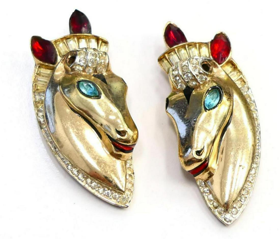 PAIR VINTAGE CORO STERLING RHINESTONE FUR CLIPS: A pair of vintage vermeil sterling silver rhinestone jeweled figural horse equestrian fur clip pins. Marked "Coro STERLING" to applied plaque on verso. Each measures approx. 2 1/4" length (5.7cm). Tot