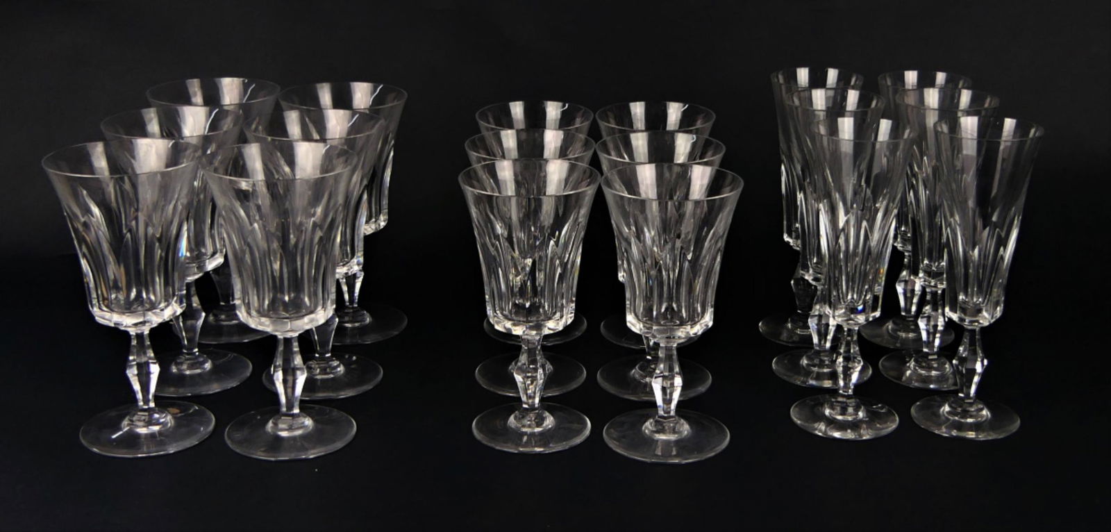 BACCARAT (18) GLASSES 6 RED 6 WHITE 6 CHAMPAGNE: We offer for auction 18 signed Baccarat wine glasses, all the same pattern. Consists of 6 red wine glasses 7" , 6 white wine glasses 6 1/2" and 6 champagne 7 1/2" all pieces bear the Baccarat stamp