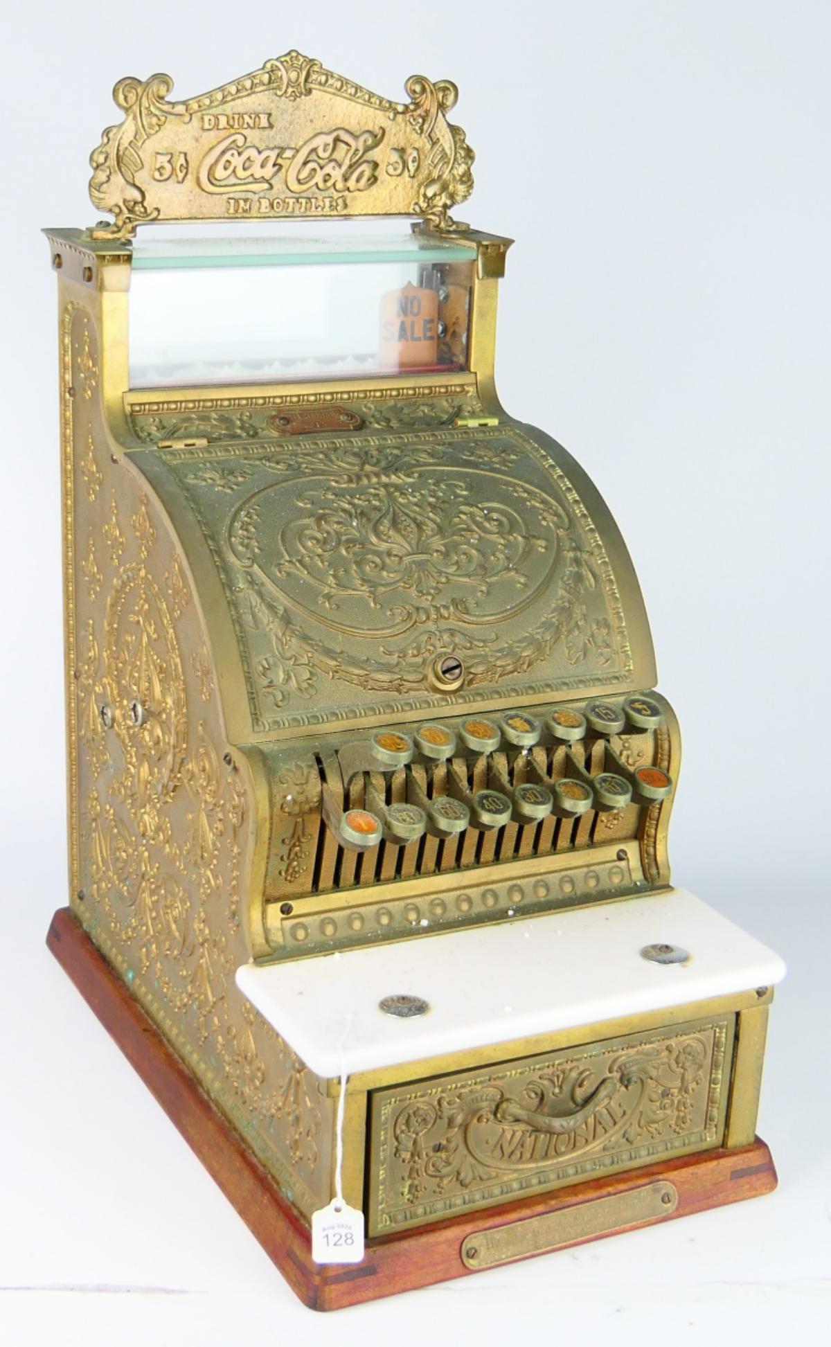 NATIONAL CASH REGISTER #313 "COCA-COLA IN BOTTLES": Vintage National Cash Register Company cash register model number 313 with with "Drink Coca-Cola in Bottle" plaque. Serial number "S12069311". Appears to work. Measures approx. 20 3/4" height x 10 1/4