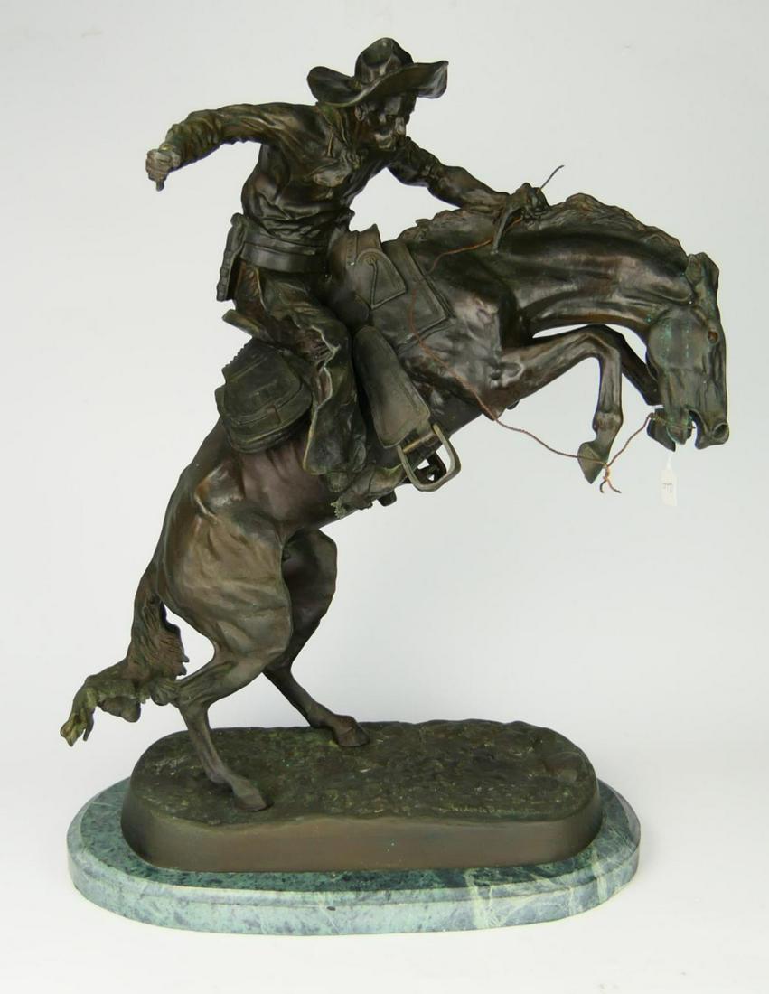 FREDERIC REMINGTON (USA 1861-1909) BRONCO BUSTER: After Frederic Sackrider Remington (AMERICAN / NEW YORK / KANSAS / CONNECTICUT, 1861 - 1909) bronze sculpture titled "Bronco Buster" depicting a man riding a bucking horse. Signed to bronze base. Plea