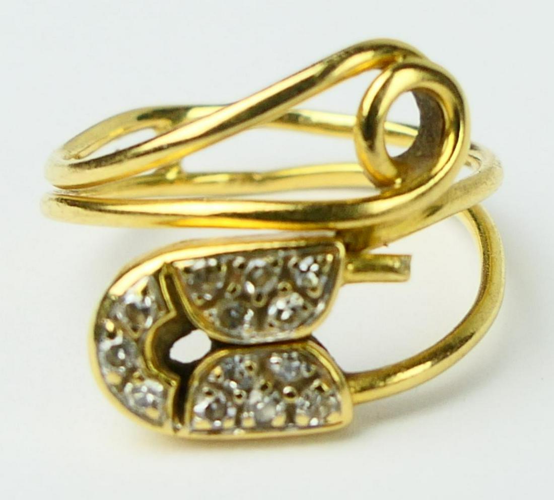 18k PIAGET YELLOW GOLD AND DIAMOND LADIES RING: Size 4. with 13 small round brilliant diamonds, Total weight 2.8 grams / 1.8 DWT