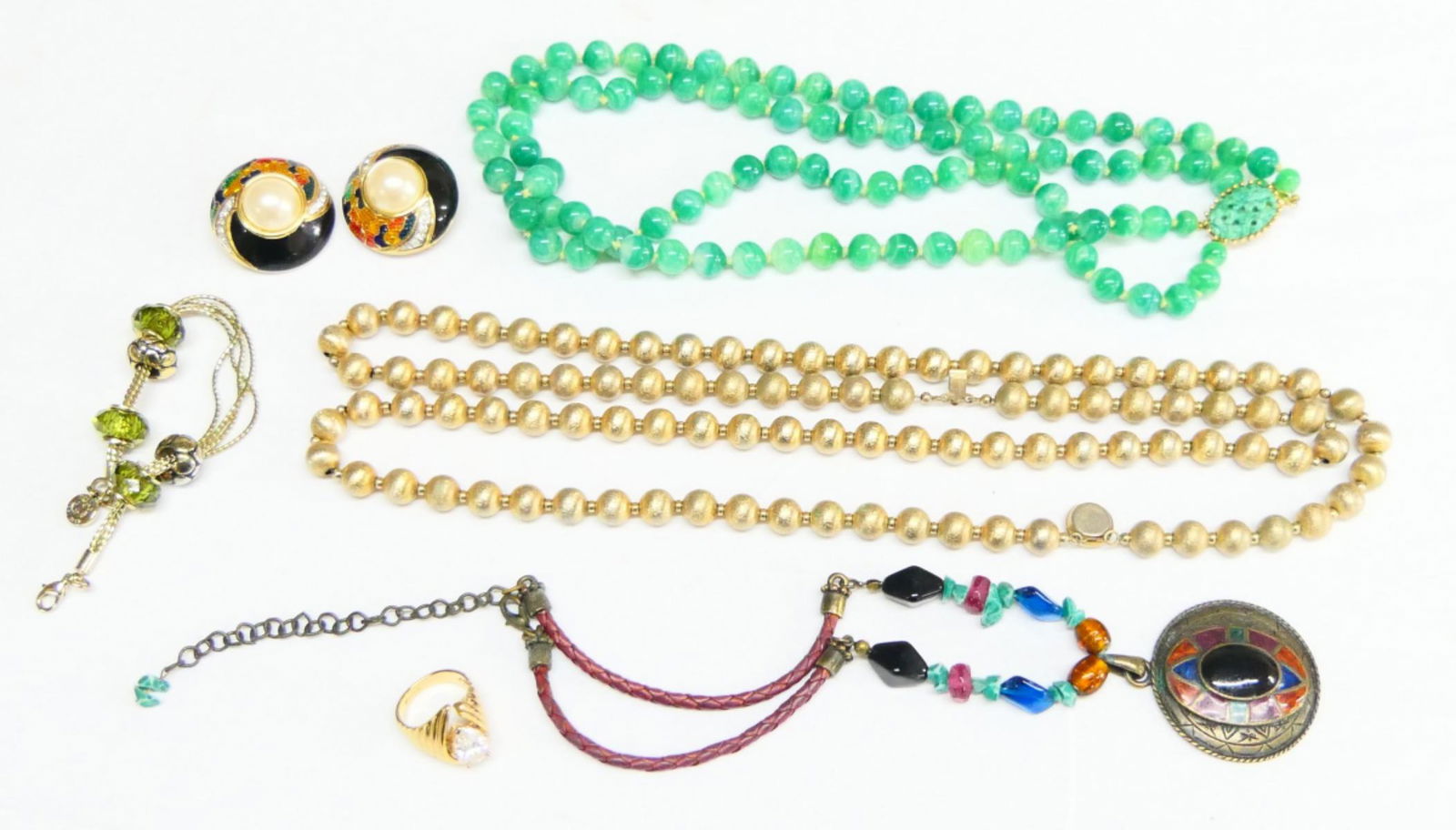 LOT OF SIGNED COSTUME JEWELRY: To include; Jomaz necklace faux jade, gold tone beaded necklace, Chicos necklace, Napier bracelet,Guy Larouche earrings, And 18kt gold filled ring with faux diaond