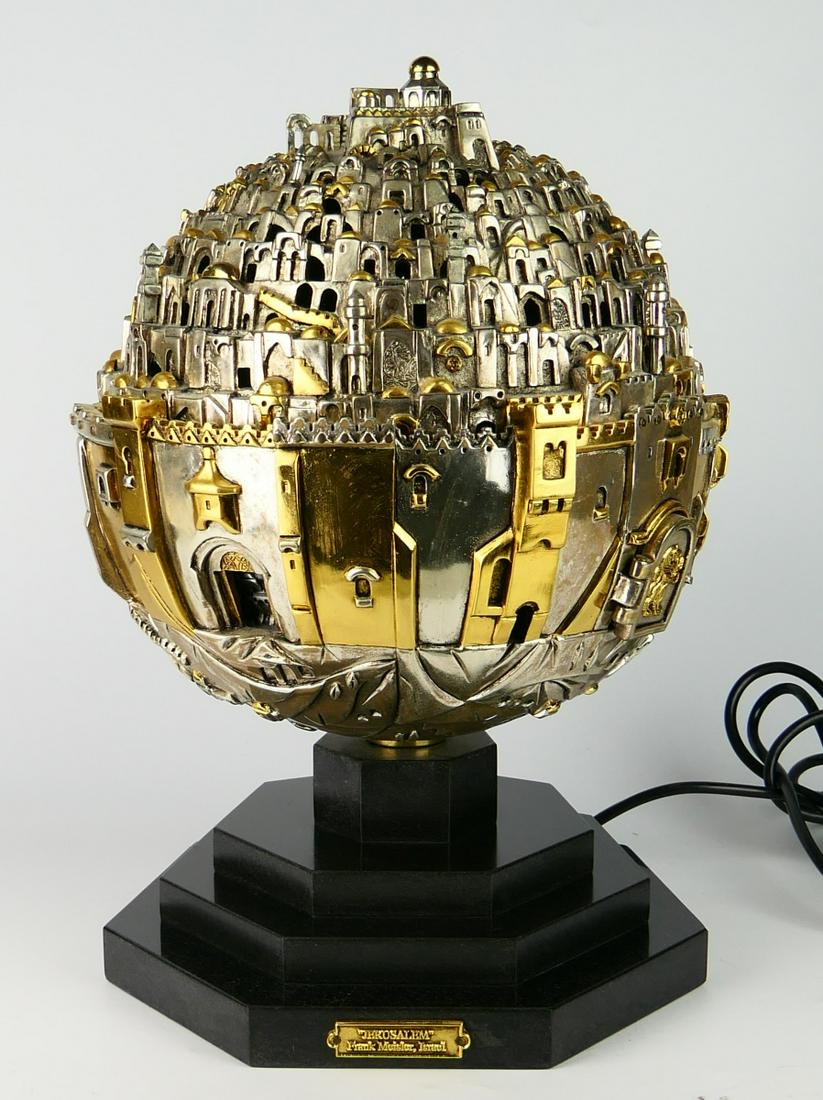 FRANK MEISLER HUGE JERUSALEM SPHERE LAMP: Frank Meisler (ISRALI, 1929 - 2018) large silvered and gold plated metal three dimensional "Jerusalem Sphere" sculpture. Dremel signed and numbered 130/190. Mounted on a tiered black marble rotating b