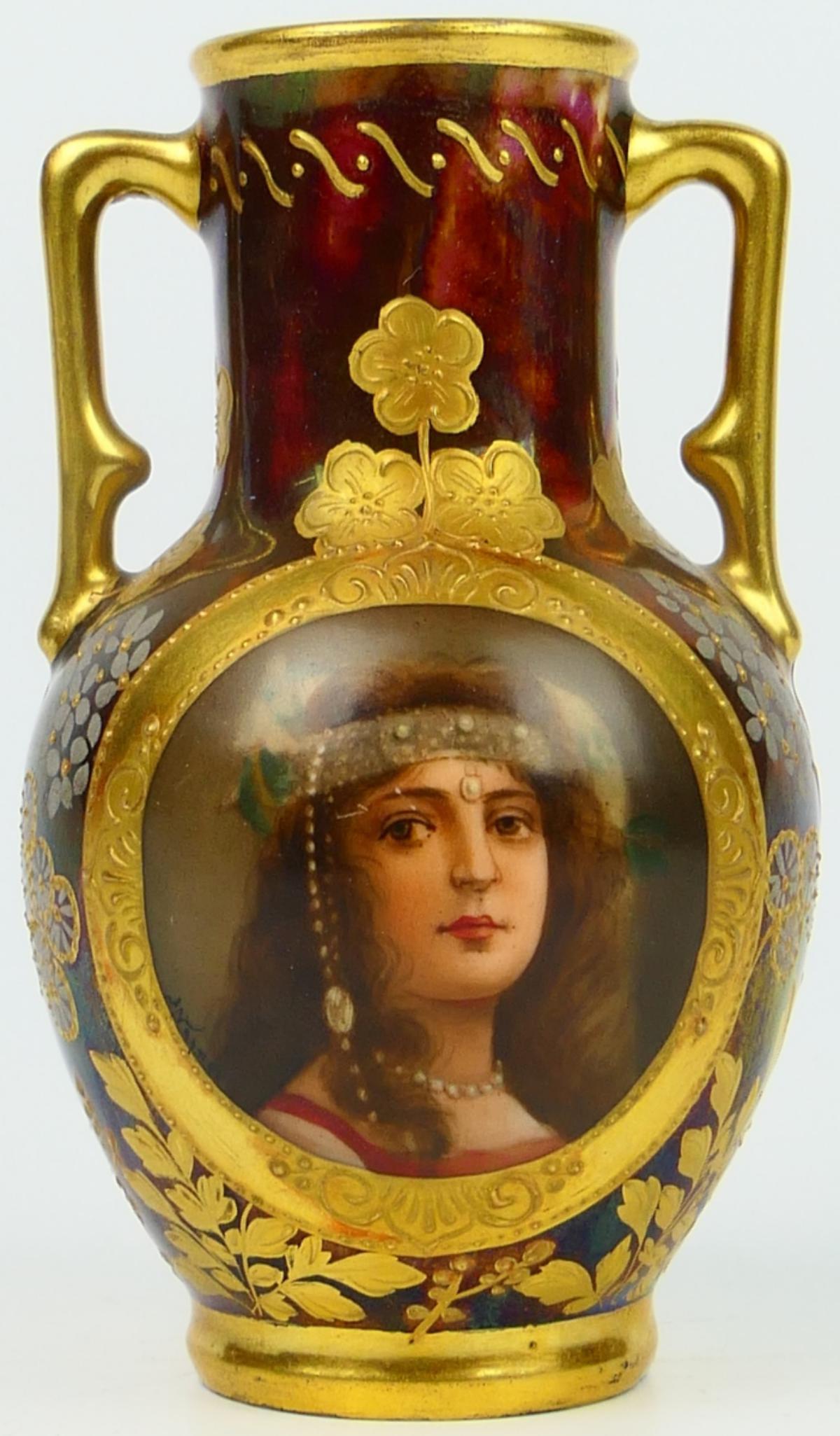 19TH C. ROYAL VIENNA CABINET VASE CLEOPATRA WAGNER: By the master artist of the period Wagner, The cabinet vase with central cartouche portrait of Cleopatra, framed in gilt embellishments on black ground, painted beading accents throughout, floral andf