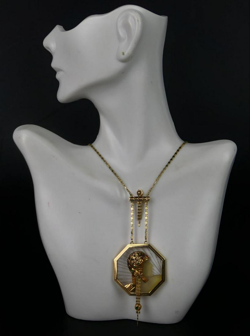 ERTE 14K GOLD ROCK CRYSTAL W/ EMERALD NECKLACE: Erte Limited edition "Aventurine" signed Circle Fine Arts 14k yellow gold Art Deco necklace with attached pendant crafted of rock crystal and accented with emerald gemstones. Signed "Erte" in script t