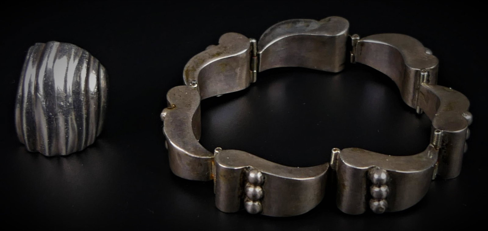 2 MID CENTURY MEXICAN STERLING JEWELRY OBJECTS: To include 7 sectional Mexican bracelet, along with a shrimp style ring...total weight 41 grams