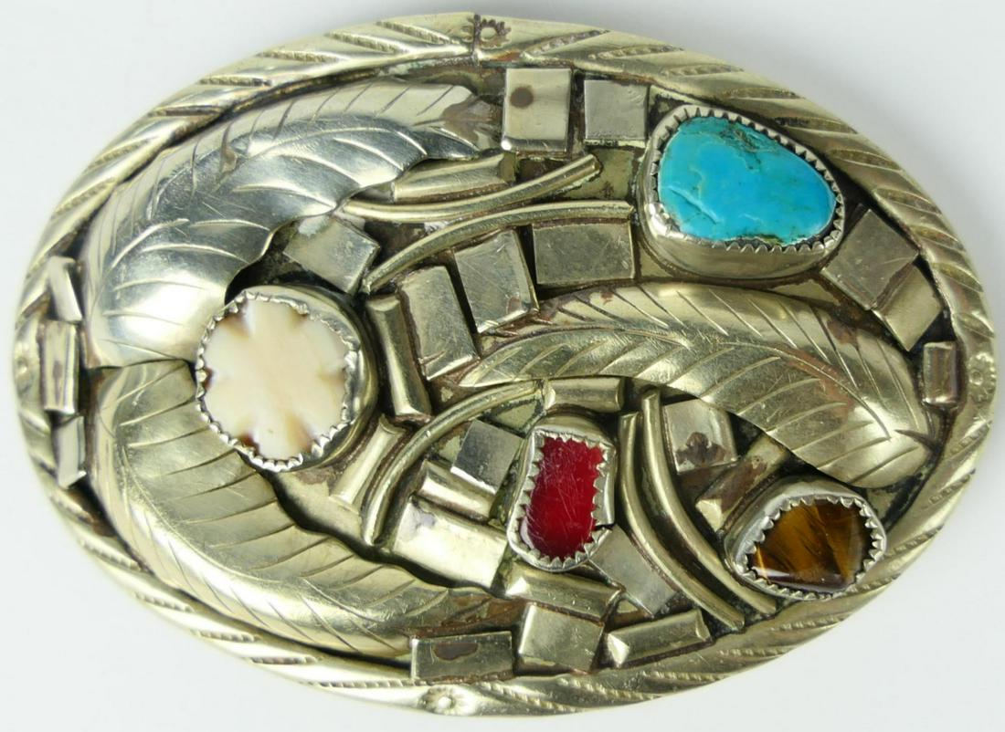 VINTAGE NAVAJO STERLING AND JEWELED BELT BUCKLE: Measures 4" wide, with turquoise, white coral, red coral and tiger eye. Marked sterling to back. total weight 65 grams