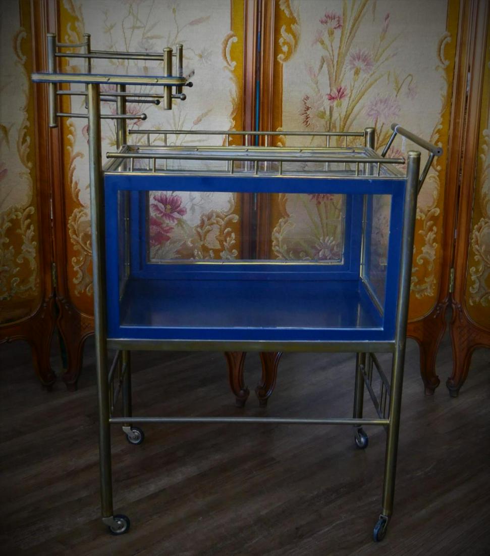 MID CENTURY BRASS WOOD & GLASS BAR TEA CART: Mid century bar cart / tea cart crafted of brass and wood with glass cabinet. Measures approx. 40" height x 32" length x 19 1/4" depth (101.6cm x 81.3cm x 48.9cm).