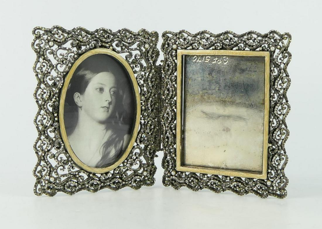 JAY STRONGWATER DOUBLE SILVERTONE CRYSTAL FRAME: Stands 6" tall X 10" wide, hold 3"X 5" photos one side oval the other side rectangular, signed to back