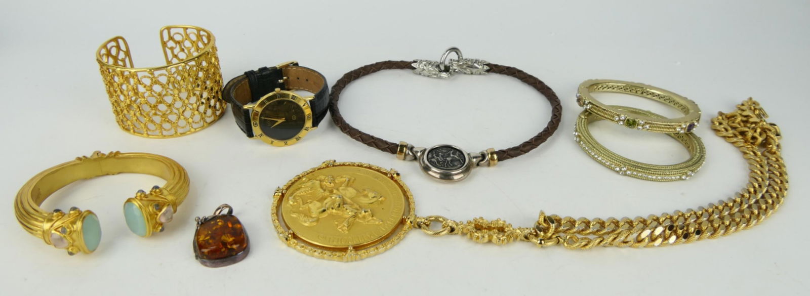 LARGE COLLECTION VERY HIGH END COSTUME INC GUCCI: To include; Gucci watch, reticulated gold tone cuff, amber and silver pendant, Julie Voss jeweled bracelet, 2 gold tone bracelets, stainless dragon choker, heavy George and the Dragon necklace and pen