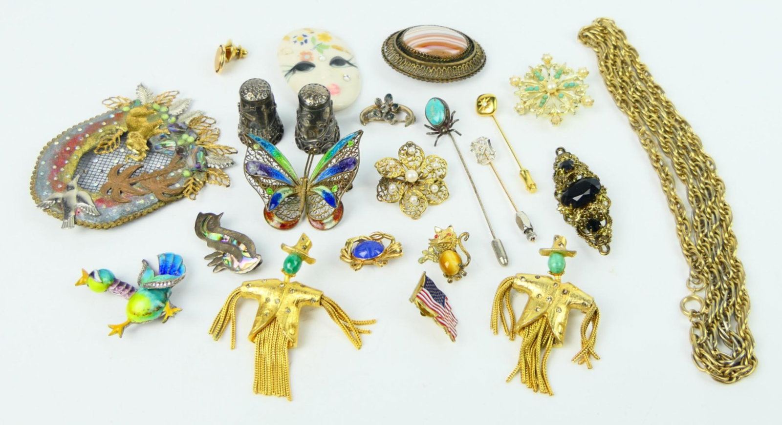 FABULOUS LOT HI END COSTUME JEWELRY SOME STERLING: TO INCLUDE; 2 sterling antique thimbles, sterling filigree butterfly pin, gold plated rope necklace, pearl pin, stick pin. dog pin, 2 scarecrow pins, elephant brooch, floral pin, gorgeous sterling bir