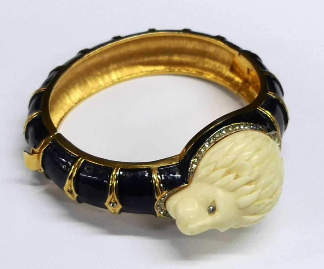 RARE HATTIE CARNEGIE CARVED LIONS HEAD BRACELET: A Hattie Carnegie Carved Lion's Head Bracelet, with all-over marine enamel and rhinestone detailing. Stamped: Hattie Carnegie.