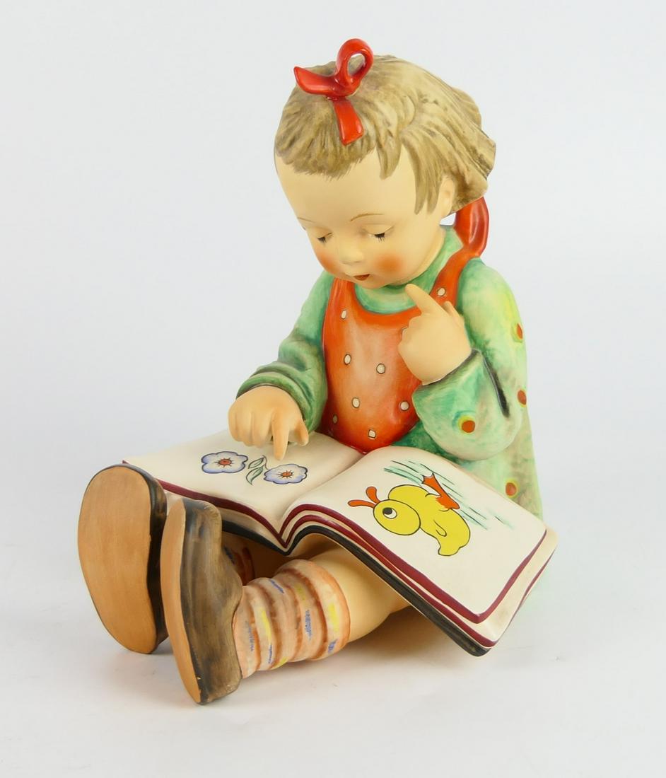 LARGE HUMMEL CHILD WITH PICTURE BOOK (1 of 3)