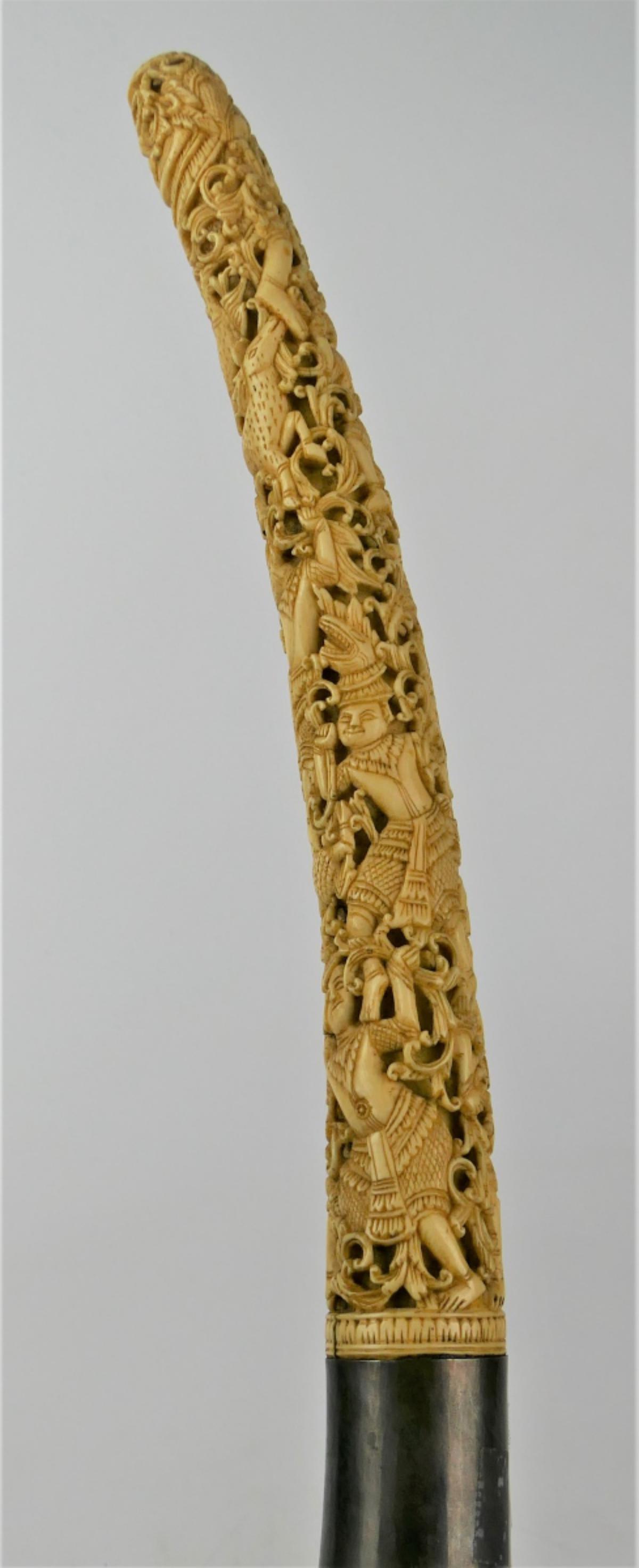 ANTIQUE THAI RATTANAKOSIN BONE HANDLE DHA SWORD: An Impressive antique Thai Rattanakosin period, probably circa mid 19th century, Dha short sword and scabbard. Sword features an intricately carved and pierced bone handle depicting numerous Khon figu