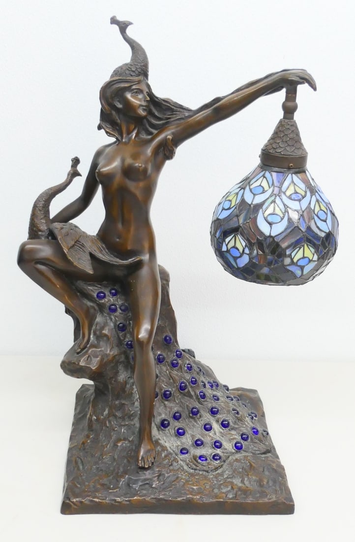 BEAUTIFUL BRONZE & GLASS TIFFANY STYLE PEACOK LAMP: BEAUTIFUL BRONZE NUDE FIGURE & LEAD GLASS TIFFANY STUDIOS STYLE PEACOK LAMP, MEASURES 23" HEIGHT.