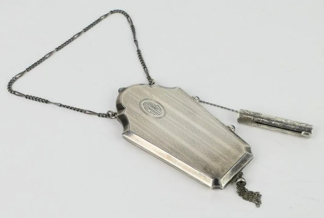 STERLING CHATELAINE MAKE UP CASE: Sterling Chatelaine Makeup Case with chain attachments. marked sterling to interior. Weighs approx 2.670ozt. measures total with chain approx 8".
