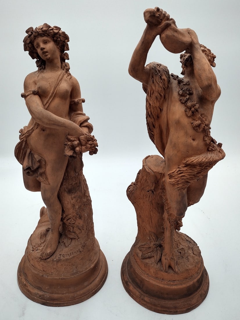 PAIR ANTIQUE SIGNED TERRACOTTA BACCHANAL PAIR: In the manner of Michel Claude Clodion (FRENCH, 1738 - 1814) a pair of antique Continental, French? or Italian? Bacchanal sculptures depicting a Satyr drinking wine and a Nymph with grapes. Signed wha