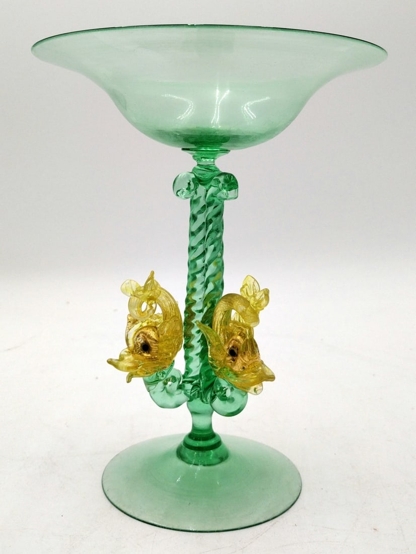 FINE VENETIAN MURANO ART GLASS COMPOTE: A fine vintage Venetian Murano Italian hand blown art glass footed compote bowl in emerald and yellow tones having a figural dolphin fish design. No apparent signature. Measures approx. 8 1/4" height