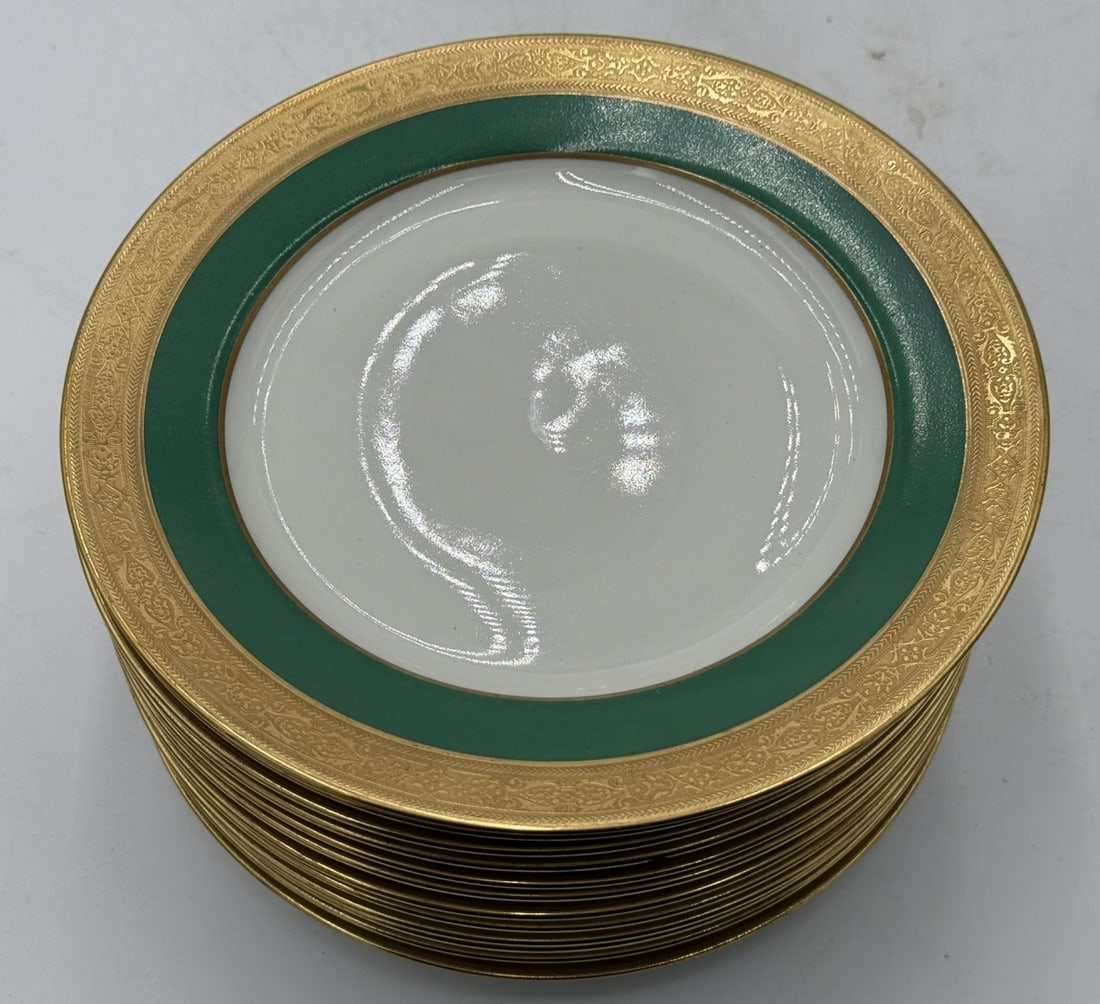 12 LIMOGES FOR DULIN & MARTIN PORCELAIN PLATES: A set of 12 Limoges French porcelain salad / dessert plates made to be retailed at Dulin & Martin Co., Washington. Plates having a gold encrusted rim with green band. Hallmarked to bottoms. Each measu