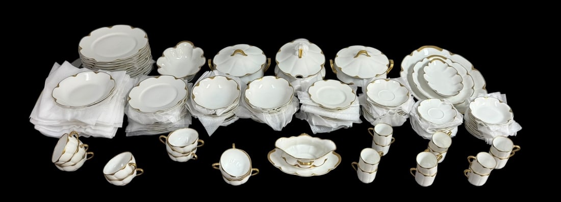 90pc Theodore Haviland Limoges Gilt Bone China Set: Lot to include a French ninety (90) piece set of gilt trimmed Theodore Haviland Limoges porcelain service set. Each bear the maker's mark stamped underneath each base. The service consists of the foll
