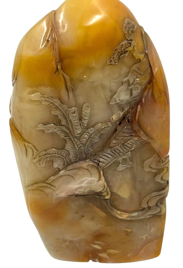 Chinese Shoushan Tian Huang Stone Seal: A beautifully carved Chinese Shoushan Tian Huang stone seal, showcasing intricate natural patterns and a polished surface. The stone is known for its warm yellowish hue and is highly valued in Chinese